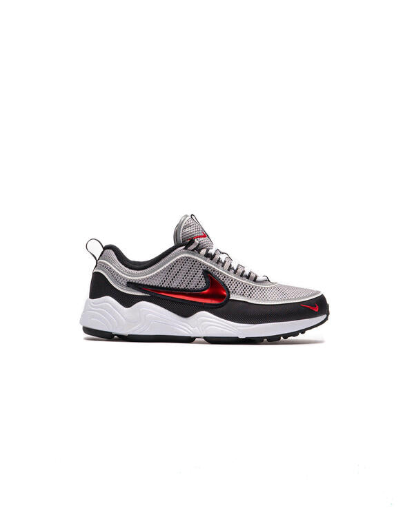 Running sneaker with metallic silver mesh, black trim, red Swoosh, white sole