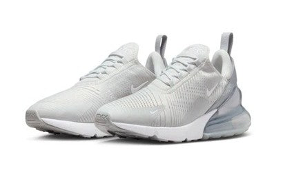 Pair of light gray lace-up Nike Air Max sneakers with mesh upper and air sole