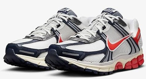 Pair of men's Nike running shoes with white-gray uppers, navy overlays, red accents