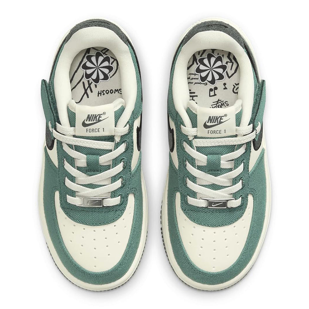 Kids low-top sneakers front view with white laces, teal trim, and black swoosh