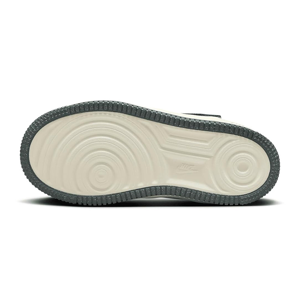 Kids sneaker outsole with light midsole and dark textured rubber grip