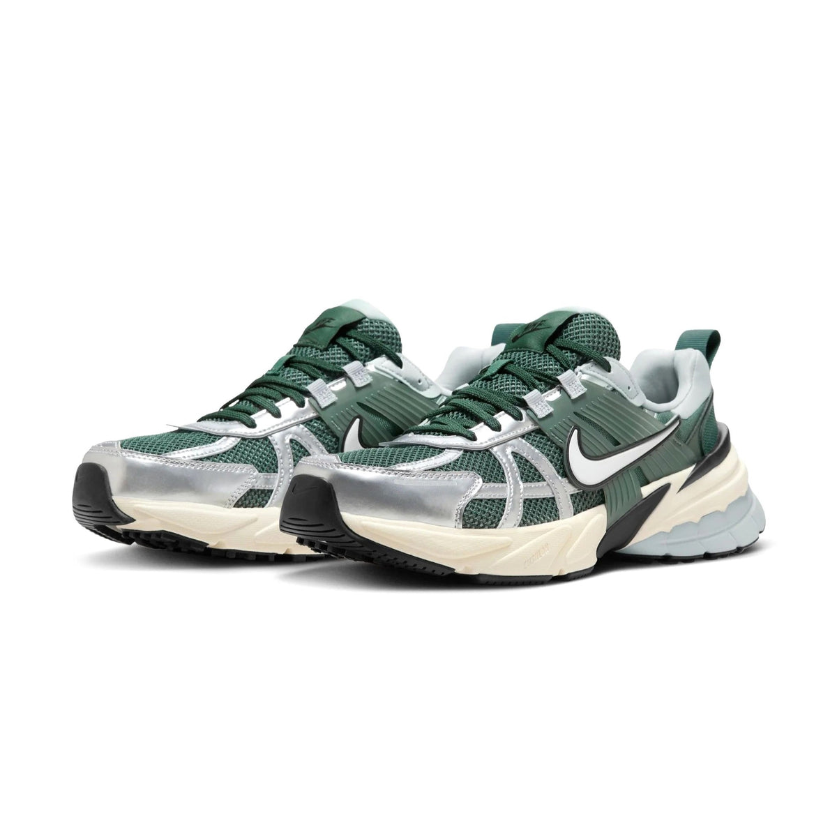 Pair of vintage green Nike V2K Run sneakers with white mesh panels and dark laces