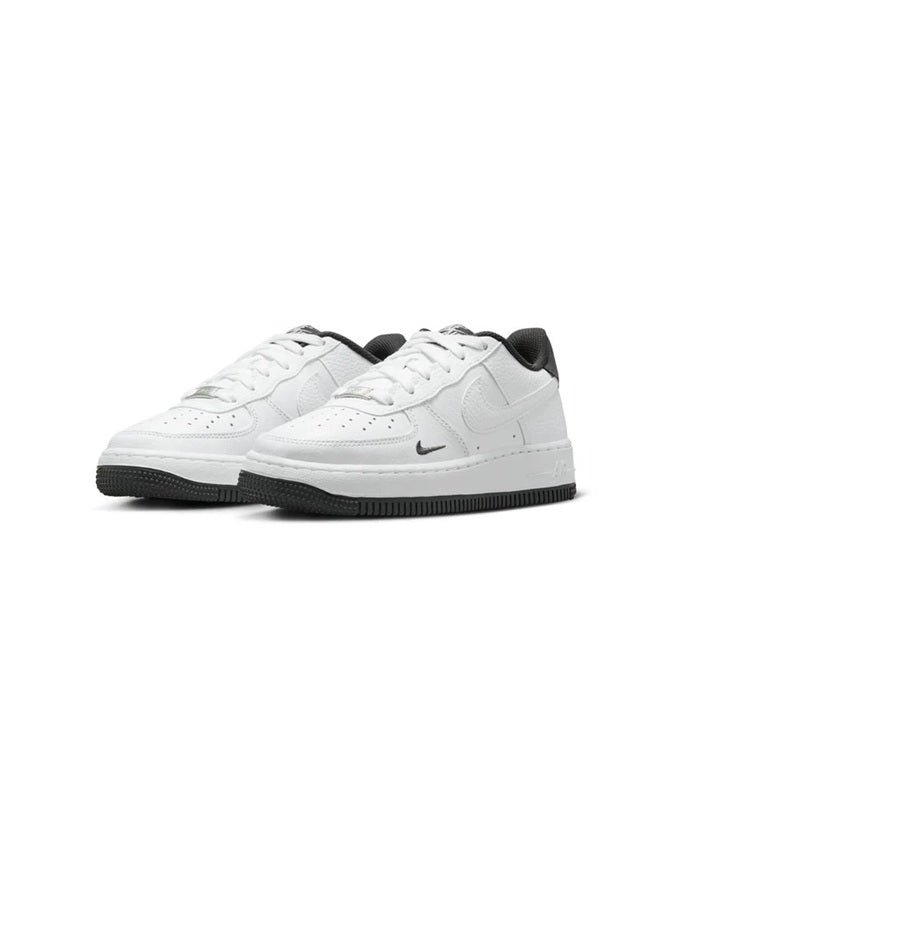 White lace-up low-top sneakers with black sole and dark heel accents, pair view