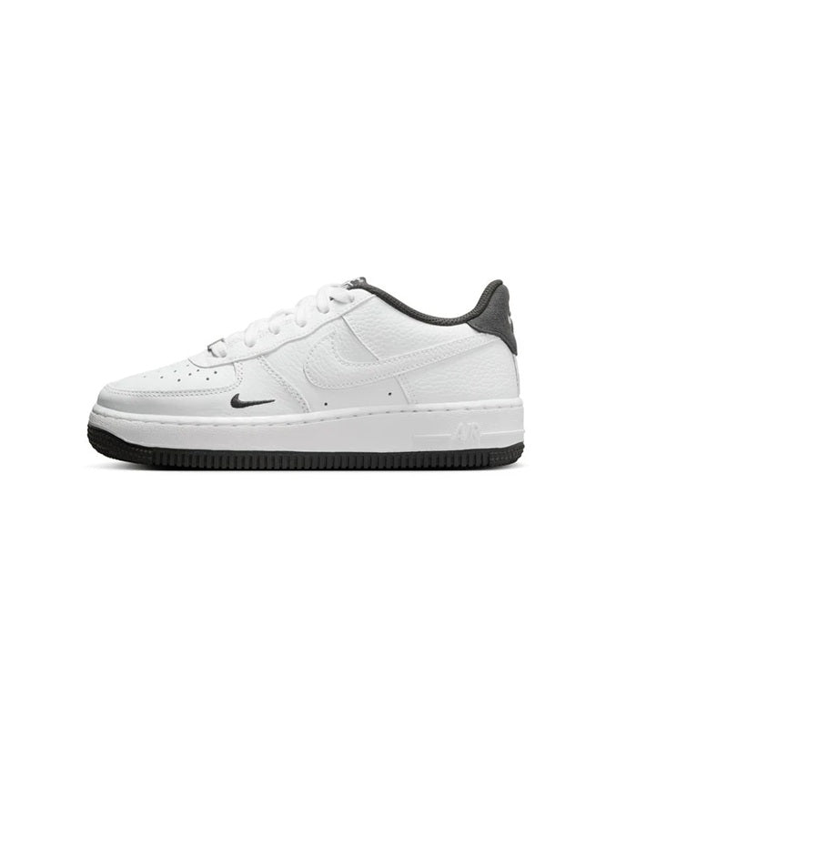 White lace-up low-top sneakers with black rubber sole and dark heel tab