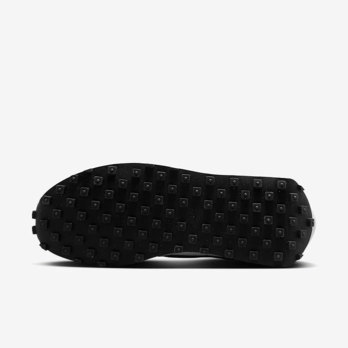 Men's black-and-white outsole with studded traction tread for grip