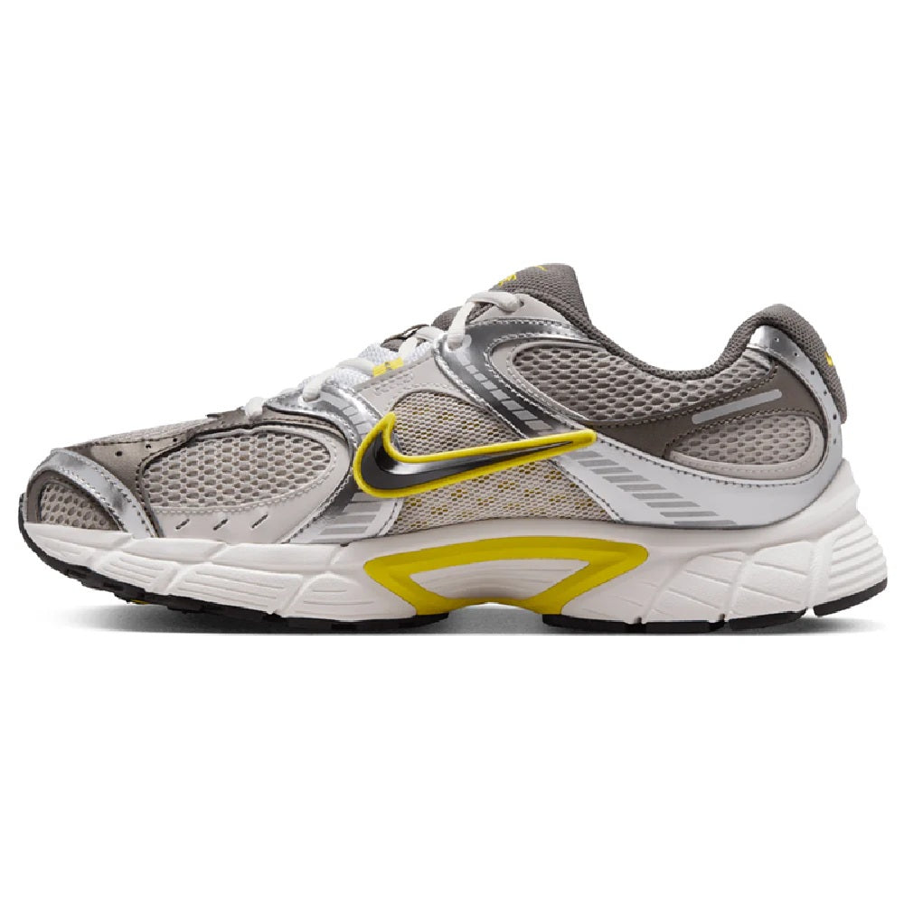 Nike lace-up running shoes, grey mesh upper with yellow swoosh and black trim.