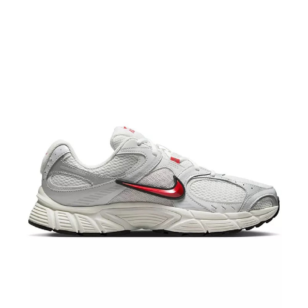 Men's Nike running shoes in white with red swoosh and black trim, side view