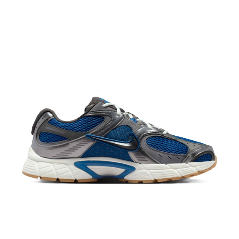 Nike V5 RNR court-style sneaker with blue mesh panels, gray overlays, and white midsole