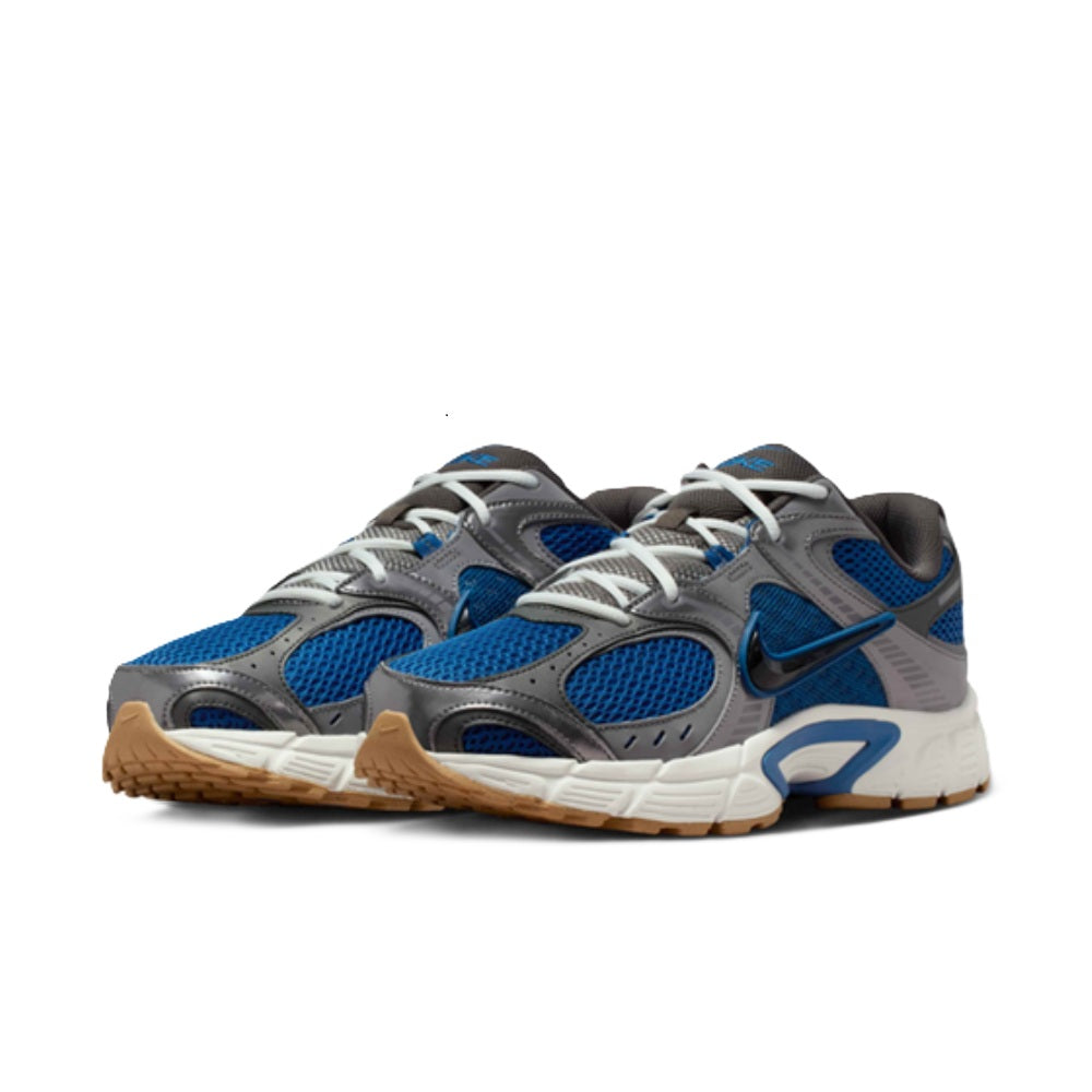 Pair of Nike V5 RNR sneakers in blue and gray with white laces and cushioned sole