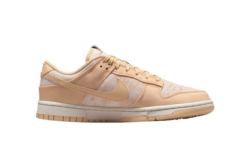 Women's Nike Dunk Low low-top sneakers, tan lace-up with white swoosh