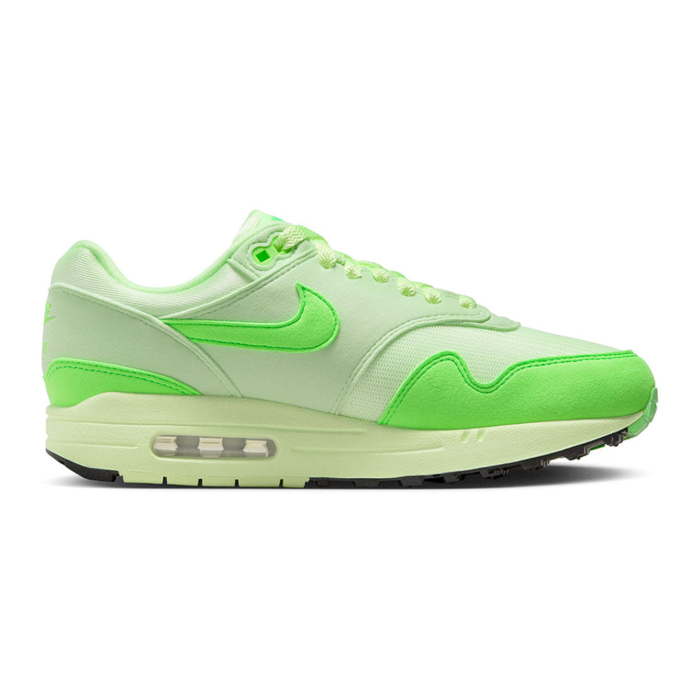 Lime green and white Nike Air Max 1 '87 runner shoe, side view with Air window