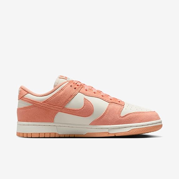 Women's Nike Dunk Low sneakers, peach suede with white overlays and swoosh