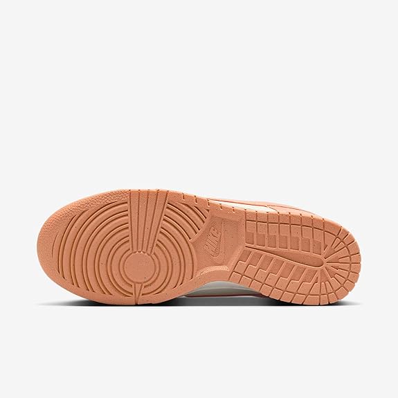 Women's Nike Dunk Low outsole, textured gum rubber with circular tread pattern