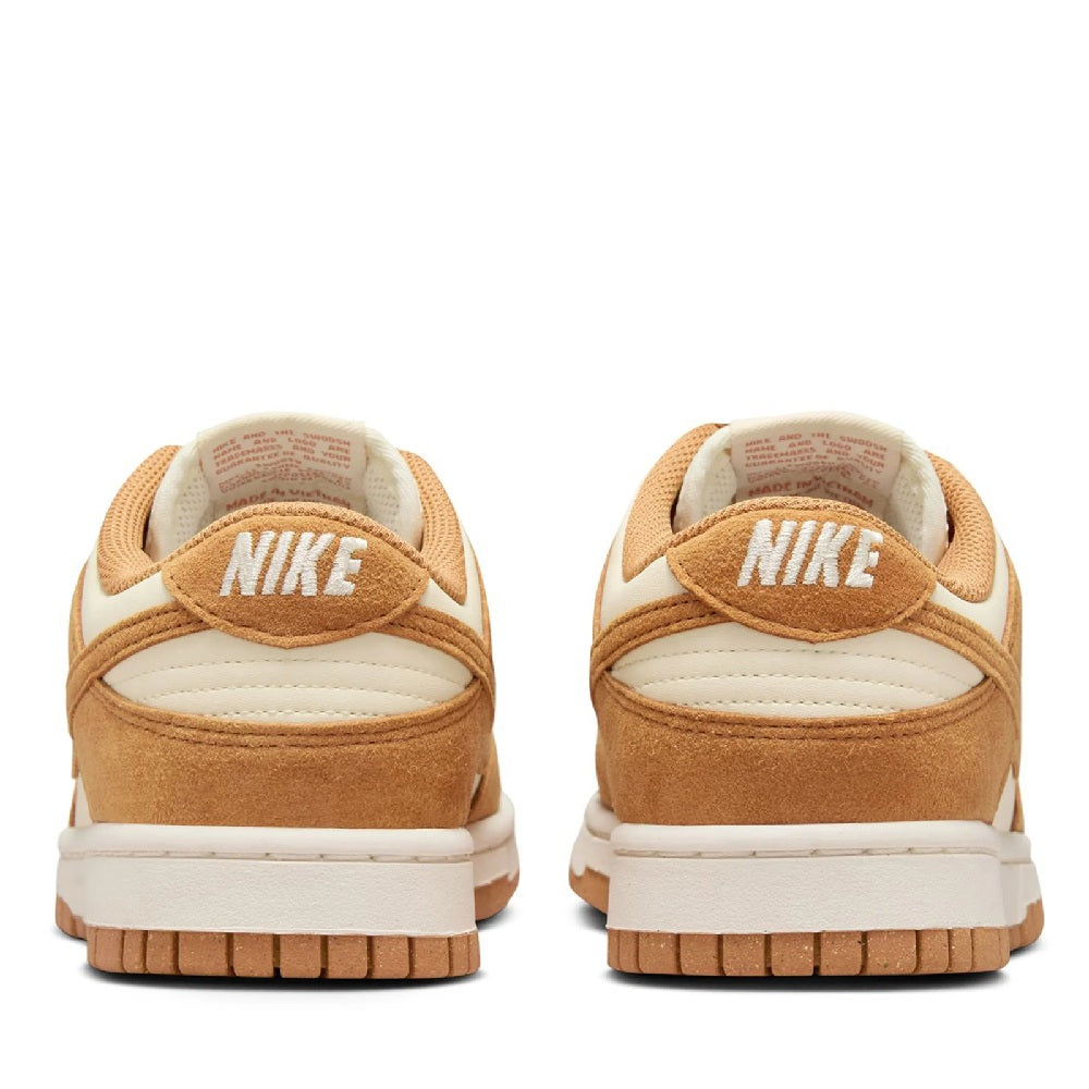 Women's Nike Dunk Low sneakers, heel view with tan suede and white midsole