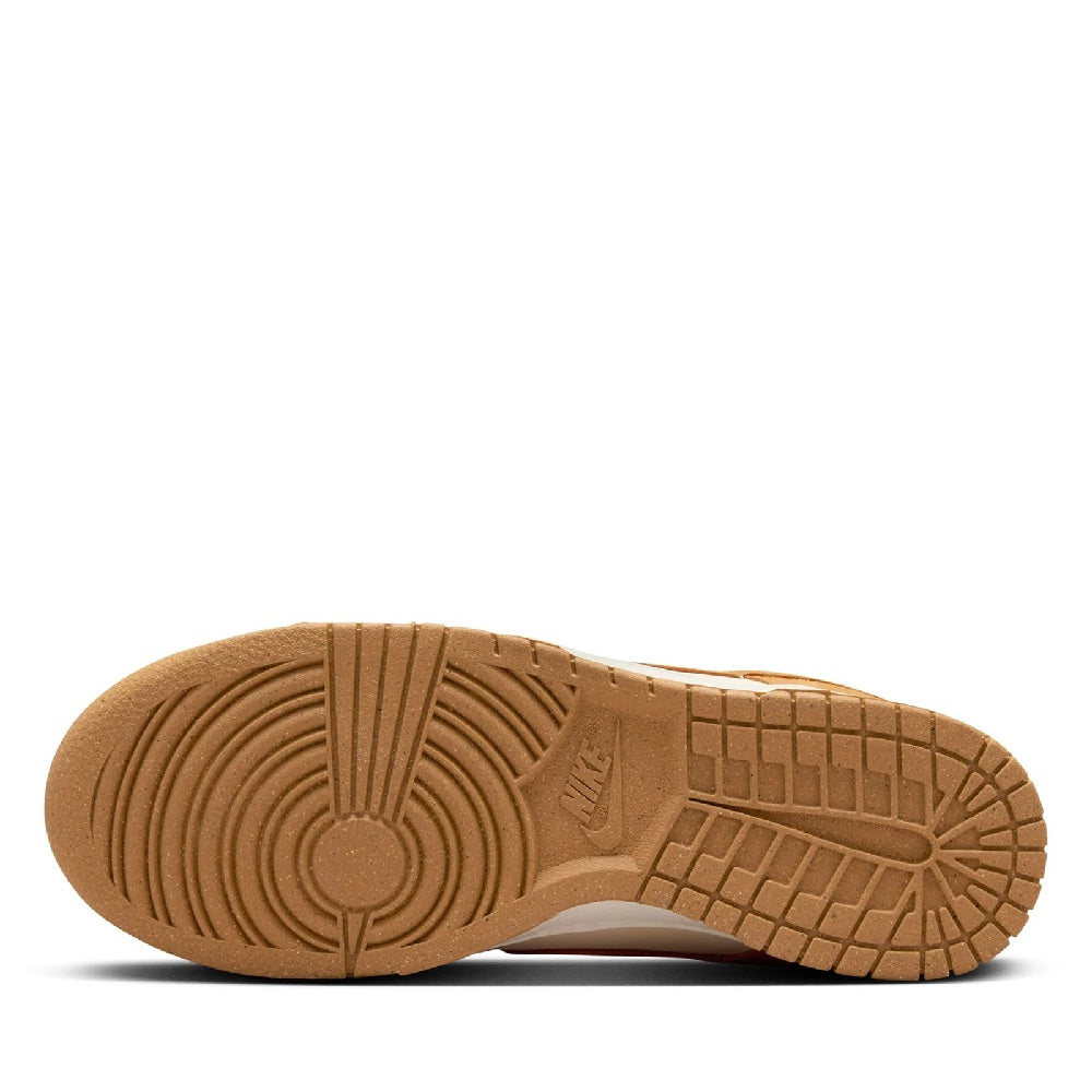 Women's Nike Dunk Low sneakers, gum rubber outsole with traction pattern