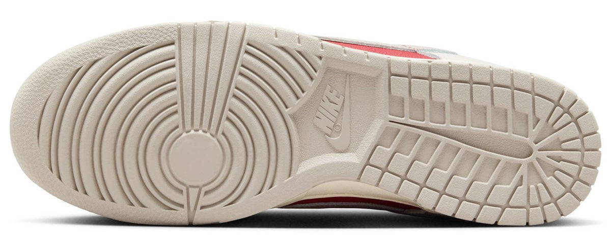Nike Dunk Low outsole view with textured rubber tread and beige midsole