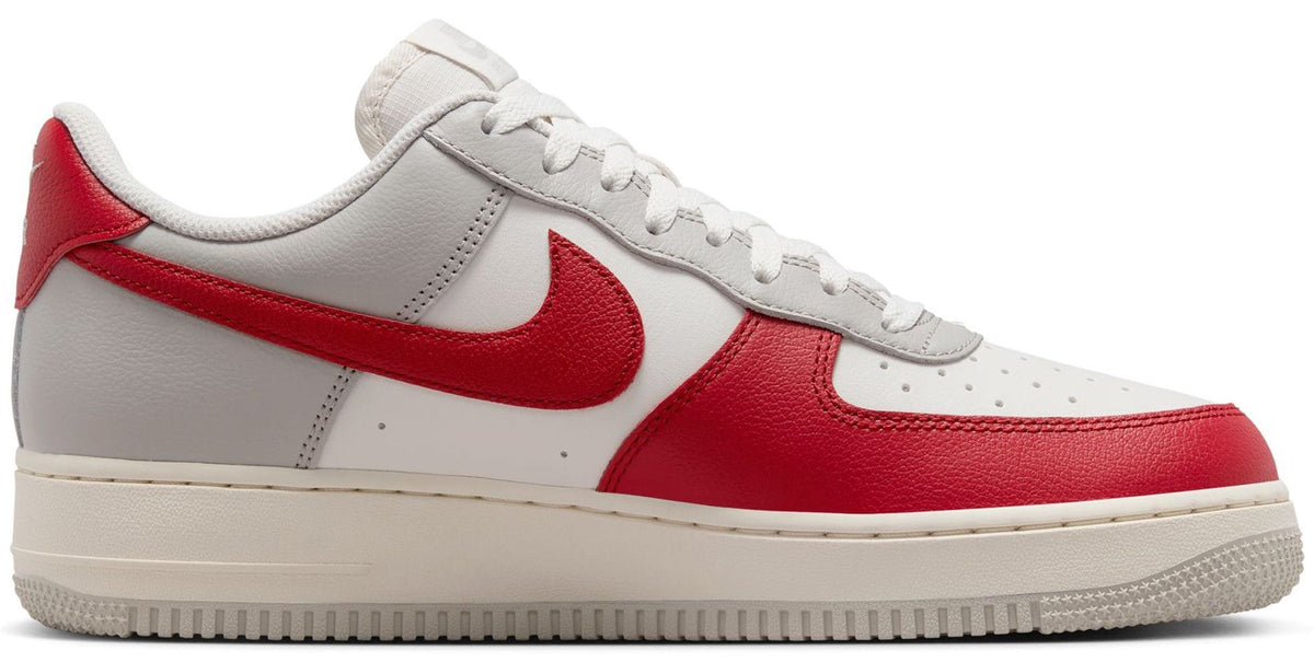 Low-top Nike Air Force 1 sneakers, gray-white leather with red swoosh panels