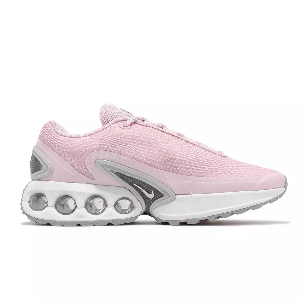 Nike women's running sneaker in pink mesh with white midsole and gray accents