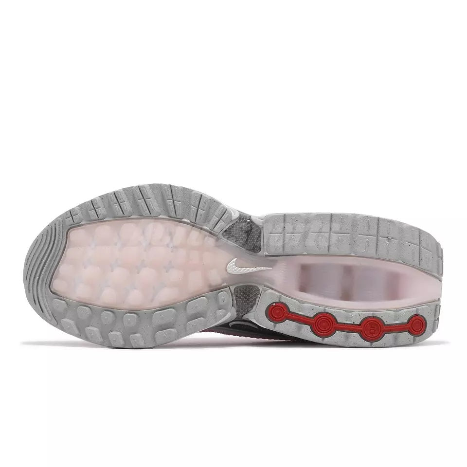 Nike women's sneaker outsole view with gray traction and pink-tinted midfoot unit