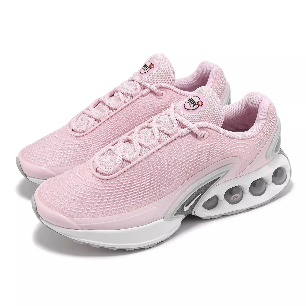 Nike women's running sneaker lace-up with pink knit upper and visible air-cushion pods