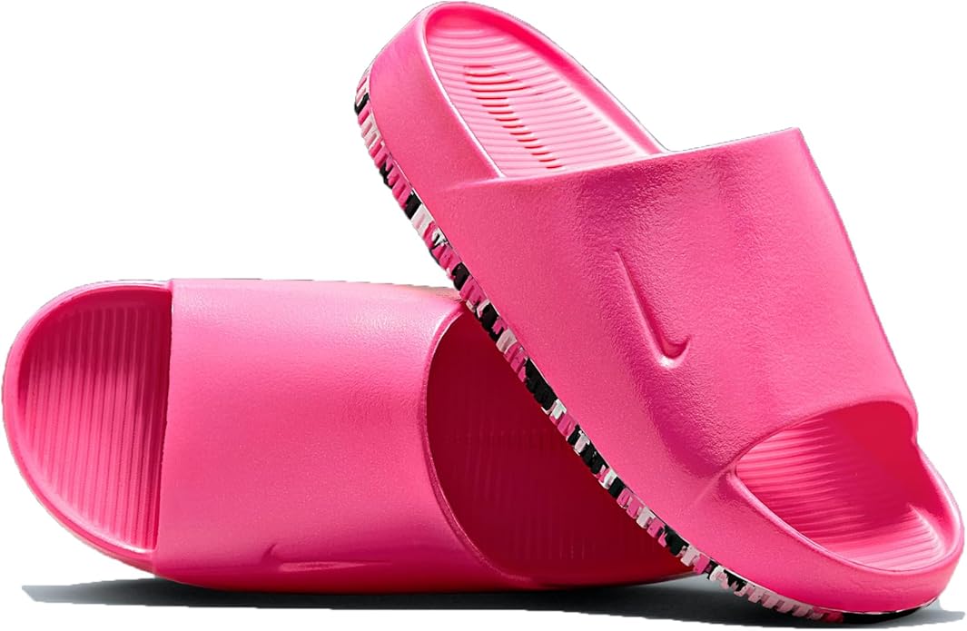 Women's pink slide sandals showing ribbed footbed and thick textured outsole
