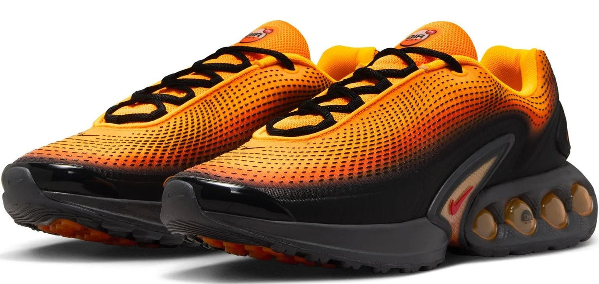 Men's Nike Air Max DN sneakers, orange perforated mesh with black heel and visible Air units