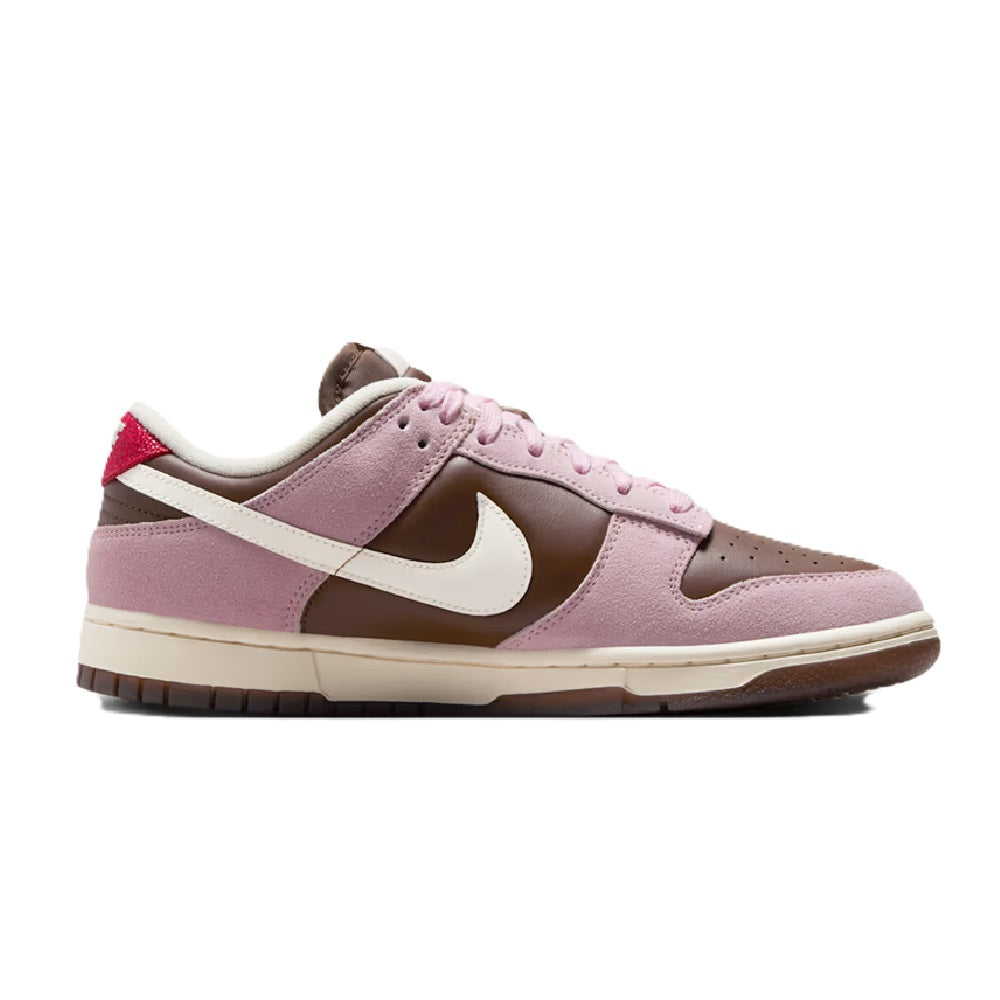 Nike Dunk Low sneakers, mauve-pink suede with white swoosh and brown heel; red accent