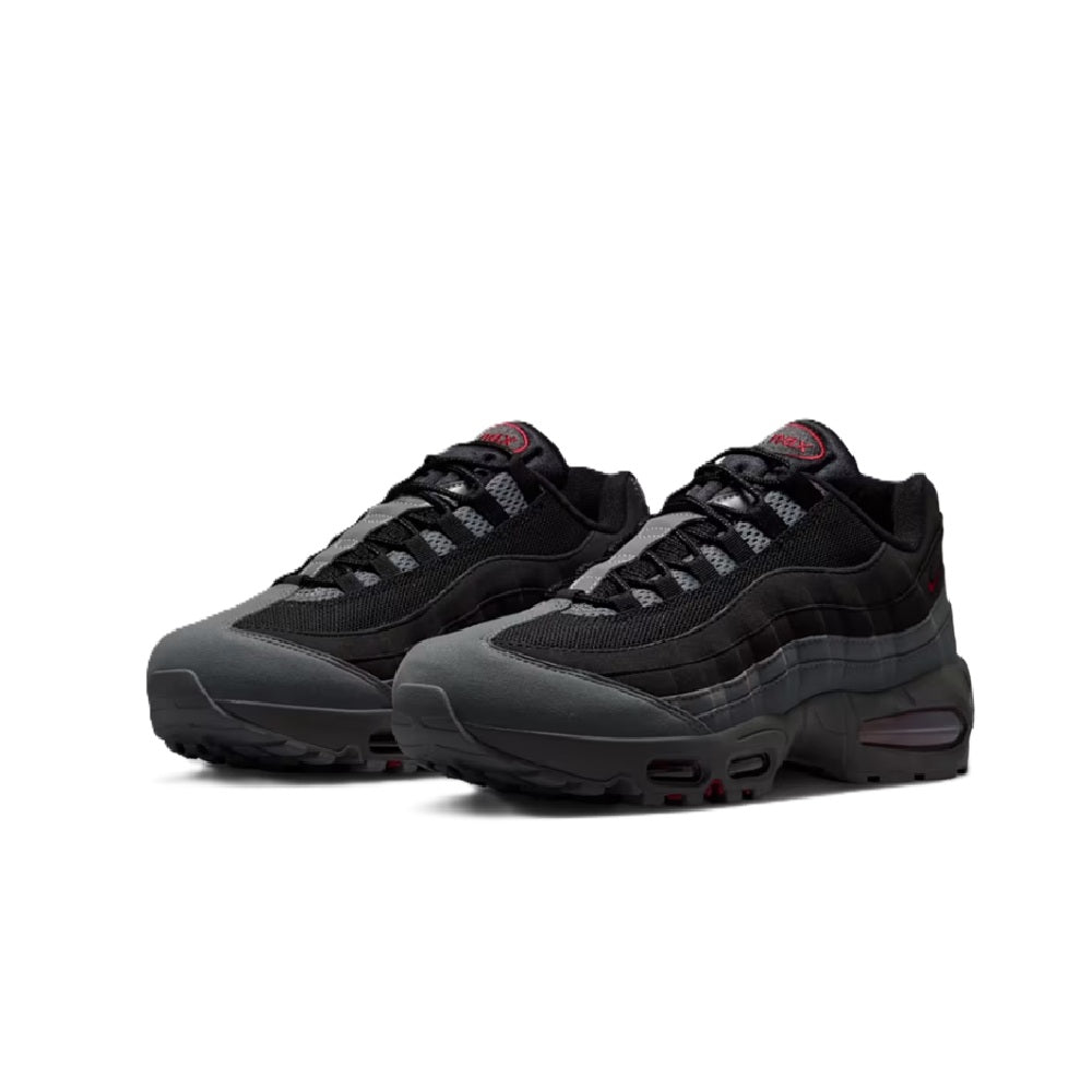 Pair of men's black sneakers with textured overlays and red-tinted Air Max heel unit