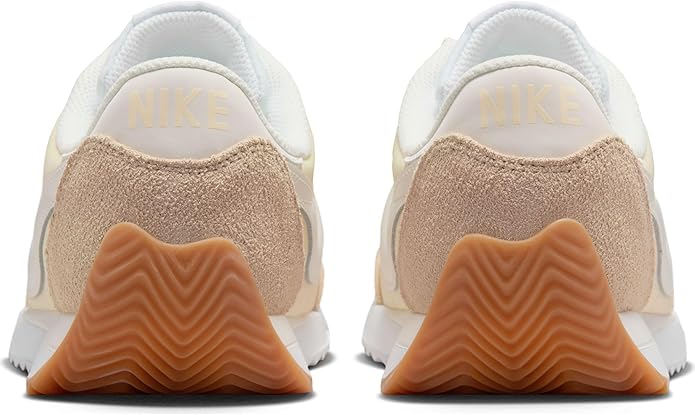 Women's Nike sneakers heels with Nike branding and tan suede heel panels.