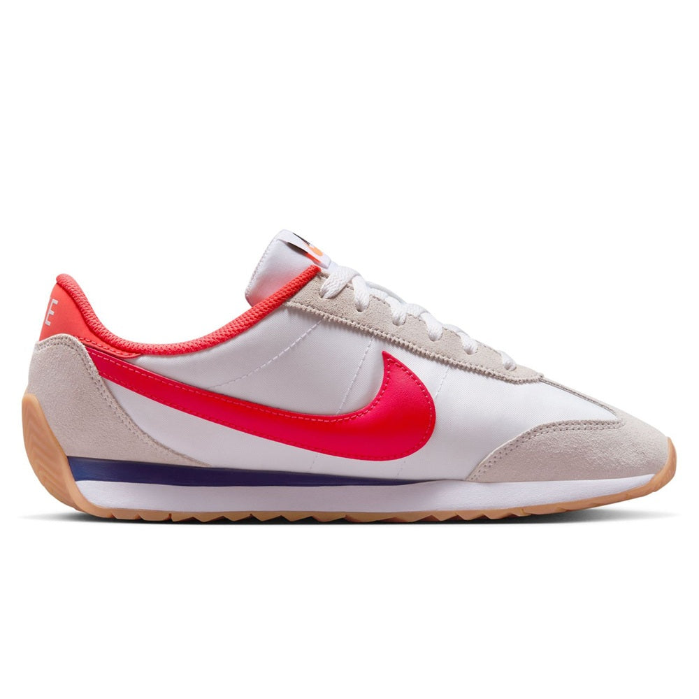 Nike women's low-top sneaker in white, red, and beige with lace-up and gum sole