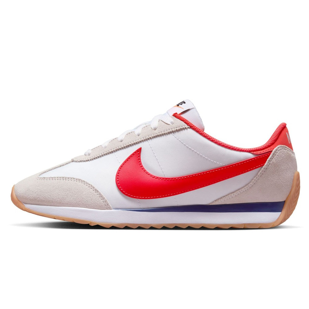 Nike women's low-top sneaker with white upper, red swoosh, beige panels, gum sole