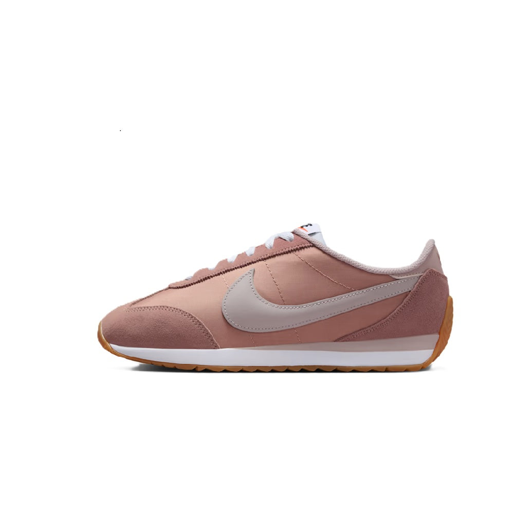 Women’s Nike low-top sneakers in dusty pink with light gray swoosh and gum outsole