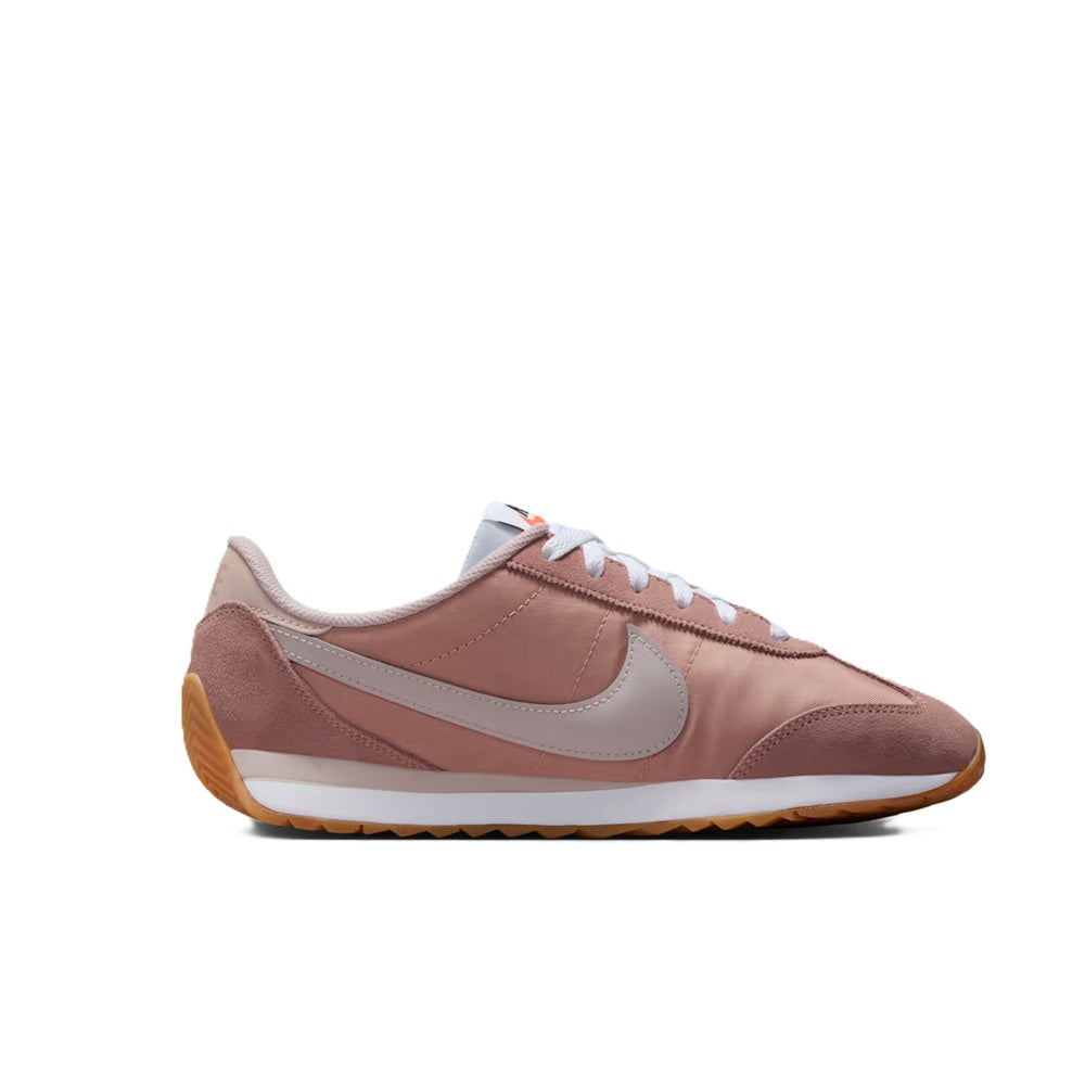 Women’s Nike low-top sneakers, dusty pink suede upper with light gray swoosh detail