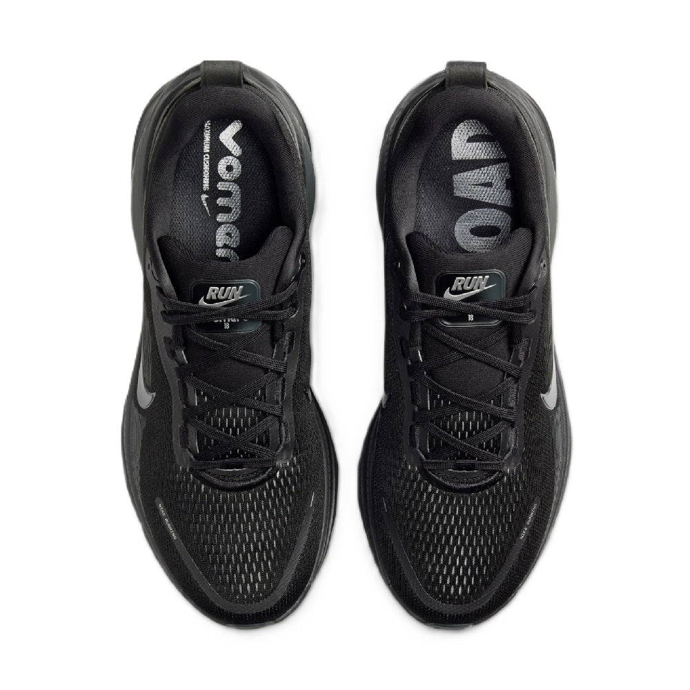 Pair of black Nike running shoes showing laces, padded tongue, and interior logos