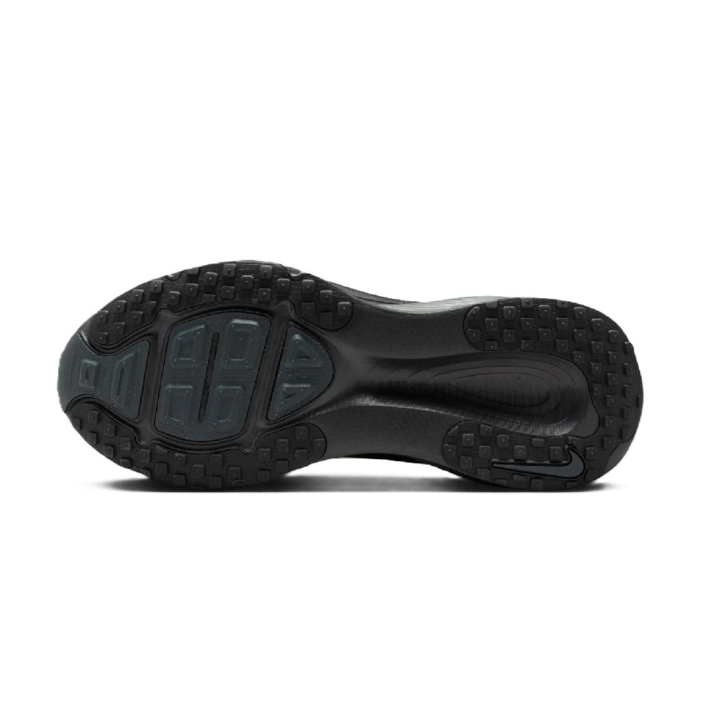 Nike running shoe outsole with deep rubber tread and sculpted midsole edge