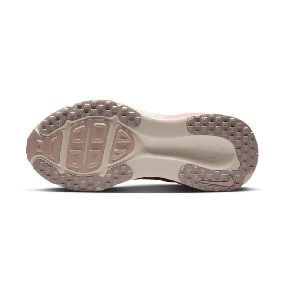 Women's Nike Vomero 18 outsole, textured rubber tread in pale pink with red pods