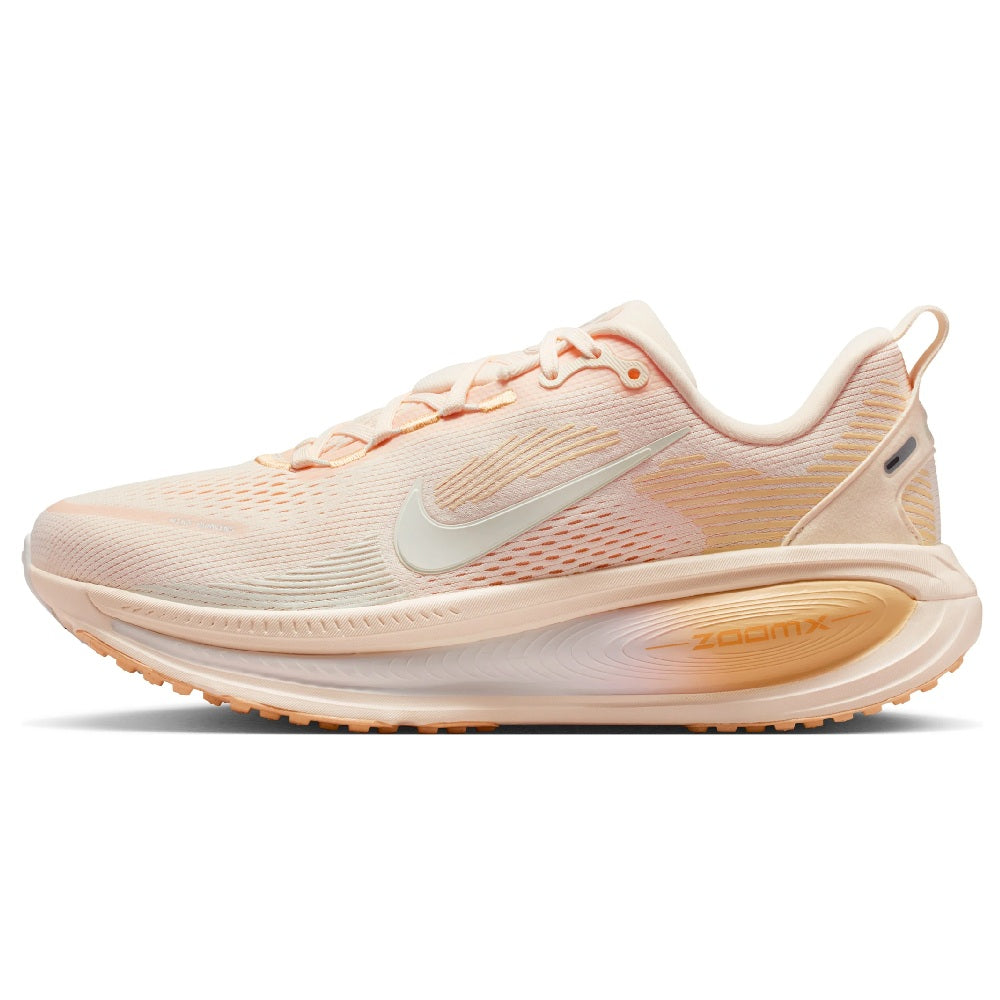 Nike Vomero 18 women's running shoe in pale peach with orange lace accents and foam sole