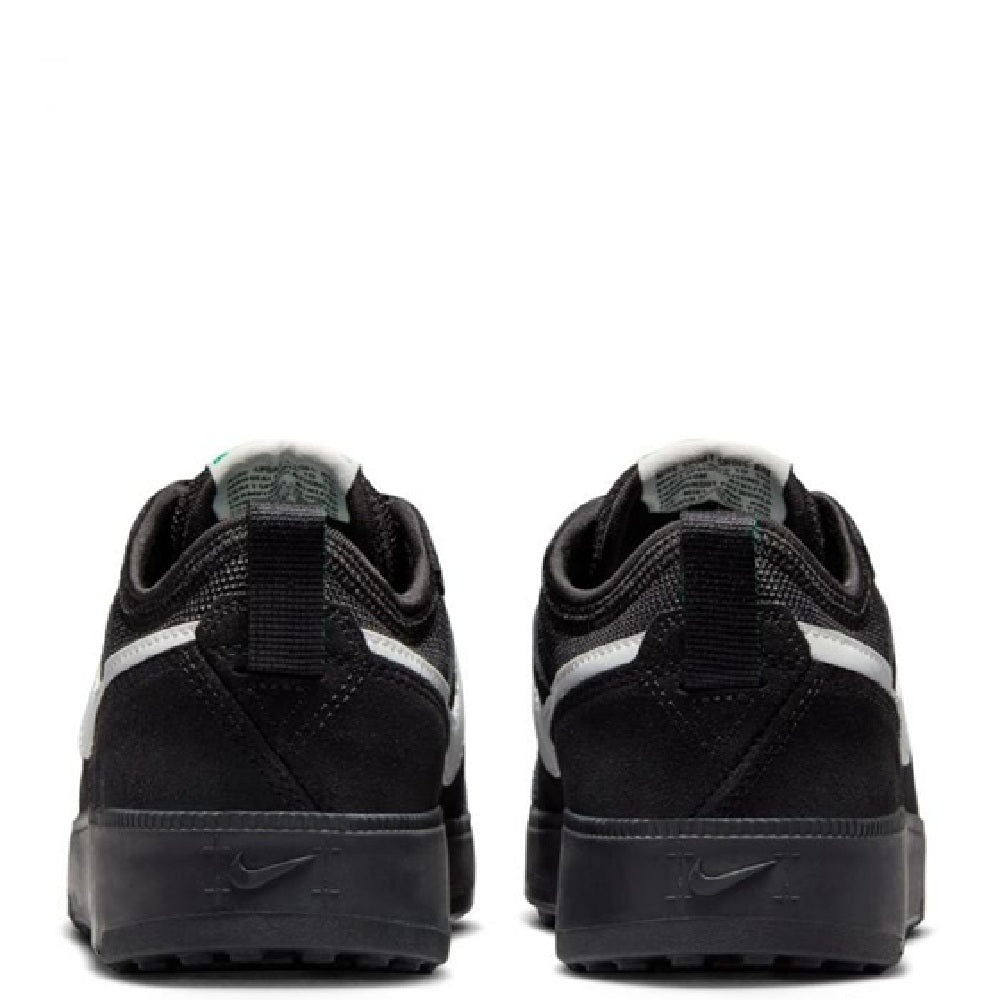 Big kid's Nike C1TY heel view, black upper with white paneling and Swoosh marks