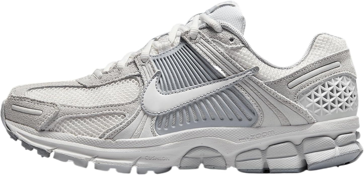 Nike Zoom Vomero 5 running shoe in light gray and white, side view with laces