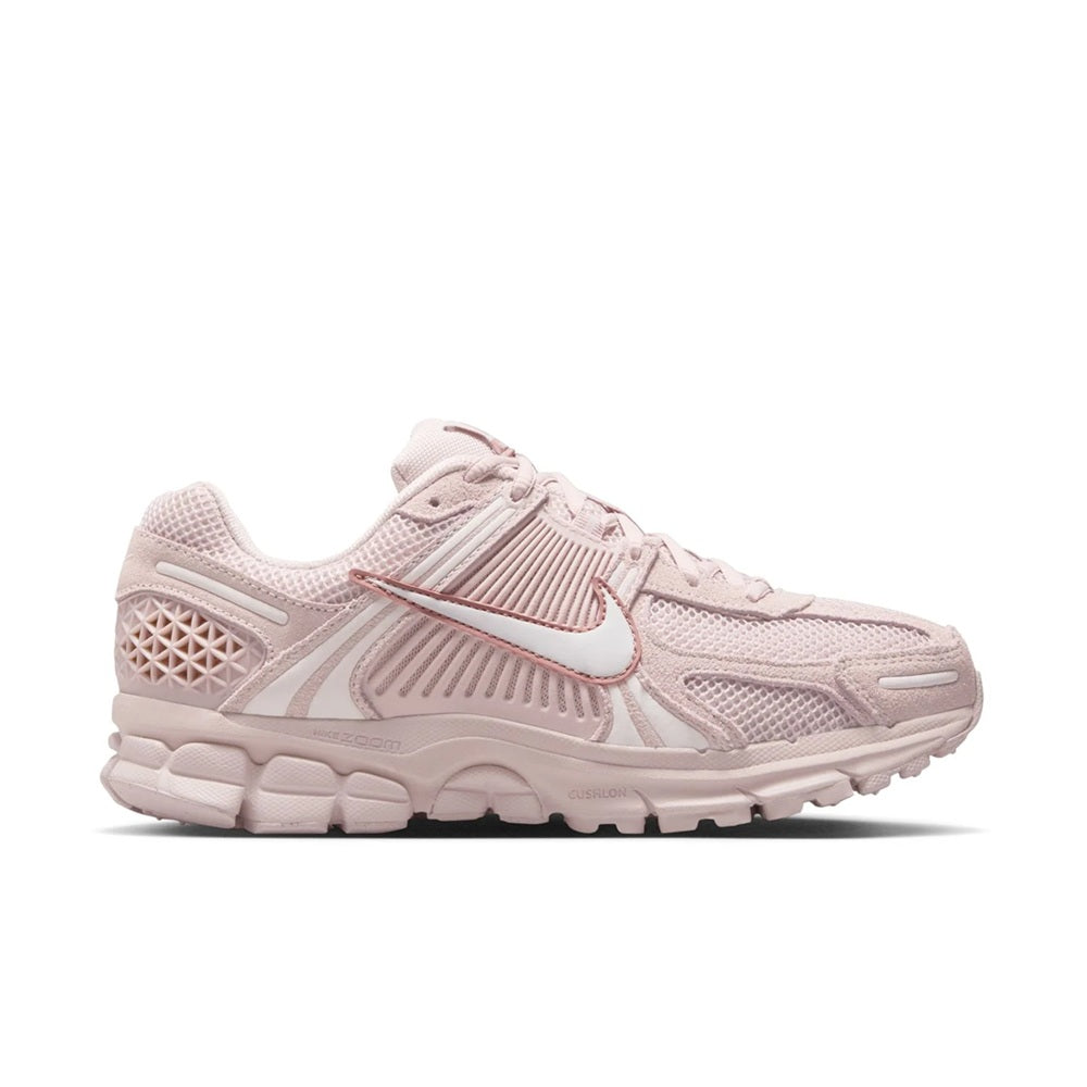 Women's Nike Zoom Vomero 5 running shoes in light pink with mesh upper and swoosh