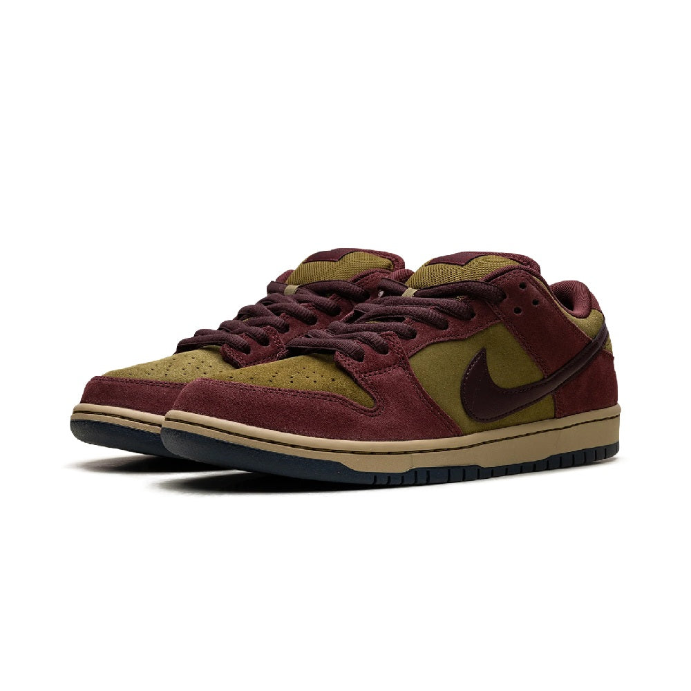 Side view of burgundy suede low-top skate shoe with olive accents, Nike Swoosh, laces
