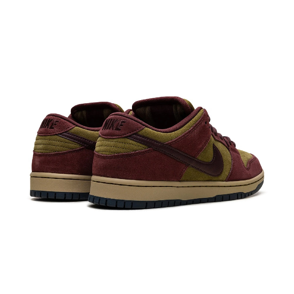 Back view of burgundy and olive suede low-top skate shoe with Nike logo on tongue