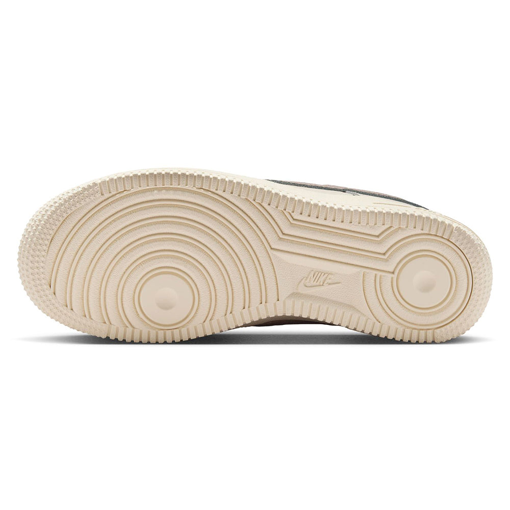 Nike Air Force 1 rubber outsole with circular tread pattern in tan.