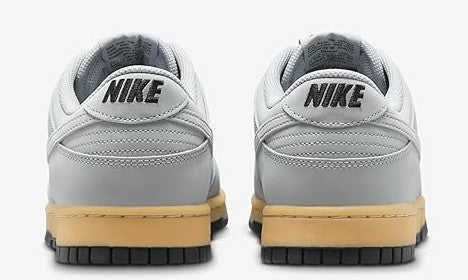 Men's Nike Dunk Low SE sneakers, rear view with NIKE heel logo and gum sole