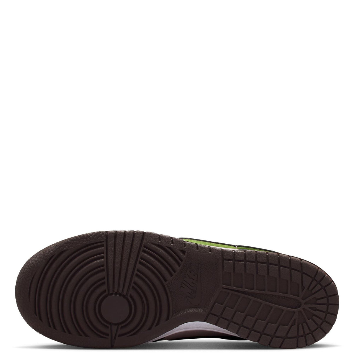 Big kid's Nike Dunk Low SE outsole view with dark tread and green accent line