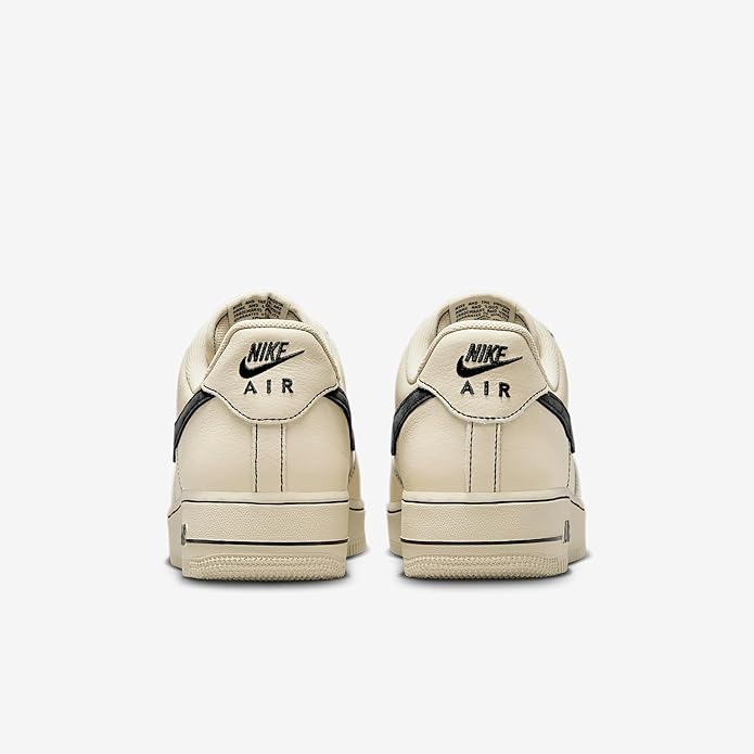 Khaki Nike Air low-top sneakers, showing heel tab and 'AIR' branding.