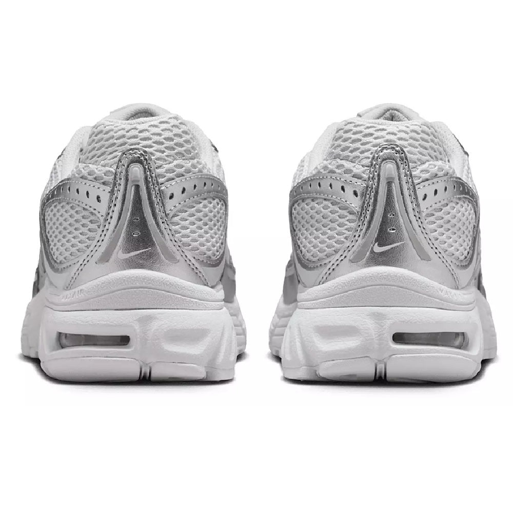 Nike Air Max Moto 2K sneakers heel view, light gray mesh with cushioned midsole