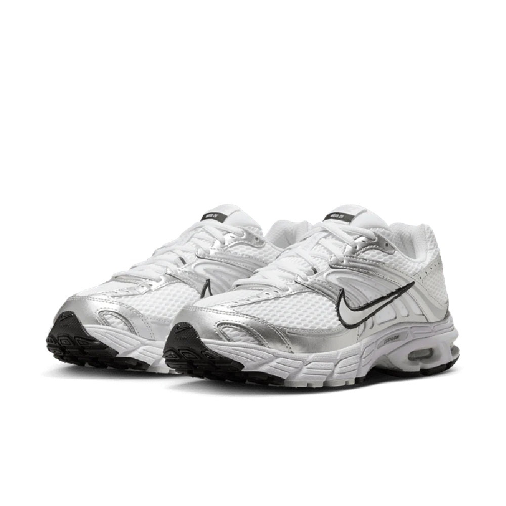 Women’s Nike Air Max Moto 2K sneakers, white mesh and leather-look panels, black swoosh.