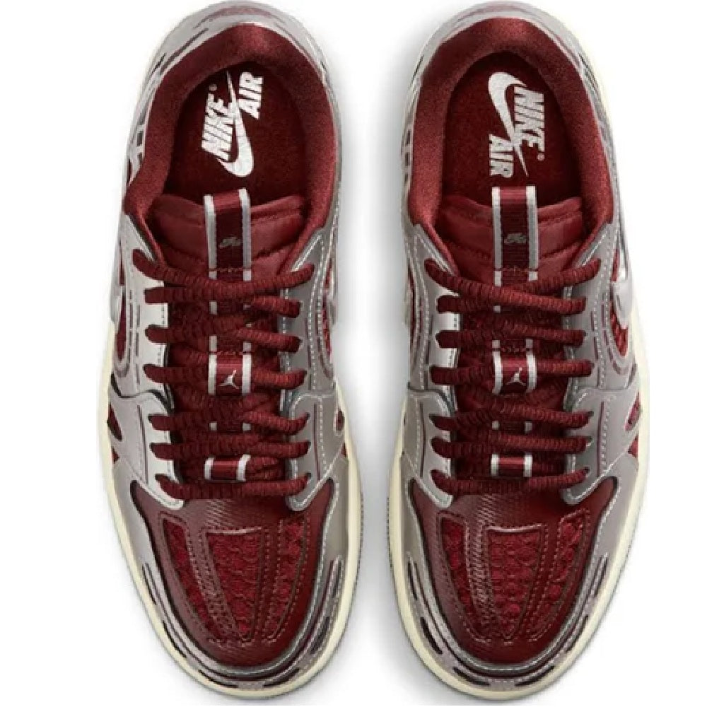 Women's low-top sneakers, showing red insoles, white uppers, and burgundy lace-up.