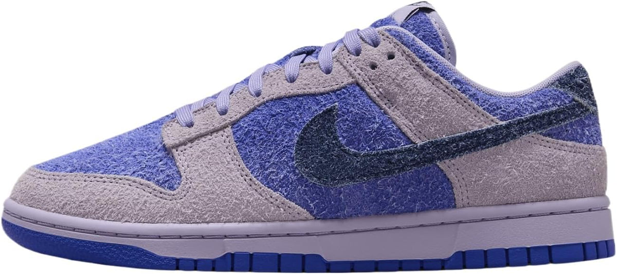 Women's low-top sneakers with light lavender suede panels and blue Nike swoosh